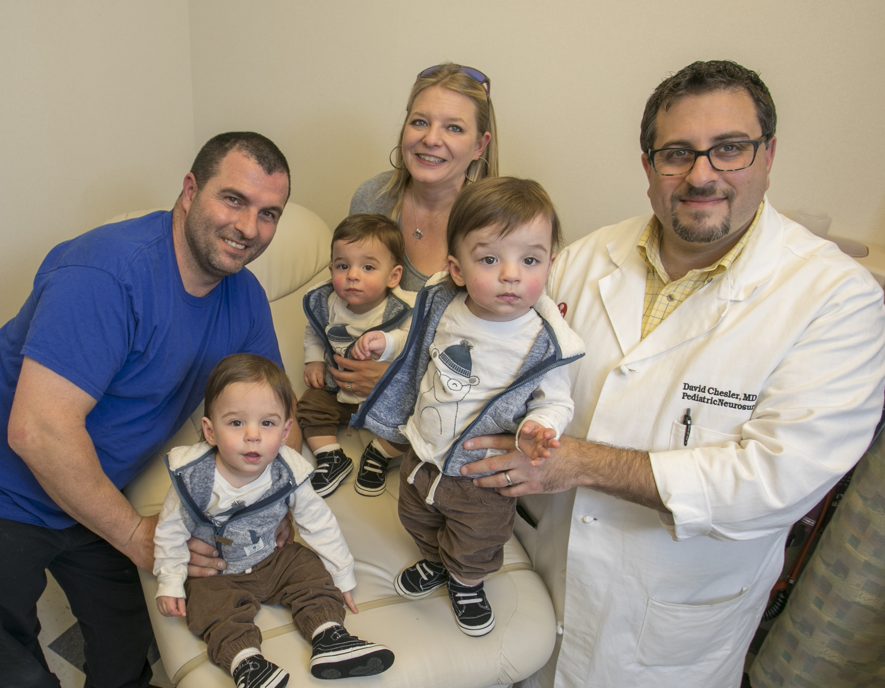 Howard triplets with parents and Dr. David Chesler