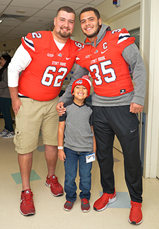 SBU football athletes visit Stony Brook Children's Hospital